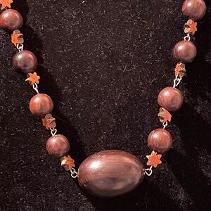 Silver tone Necklace with Brown Wood Beads and Stars. 28 inches long